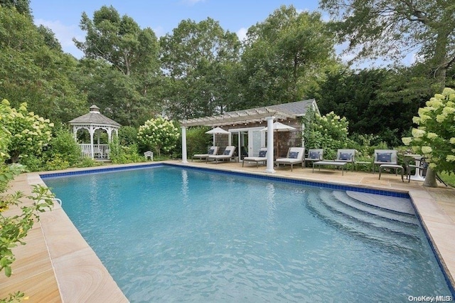 view of pool featuring a gazebo, a pergola, and a patio area