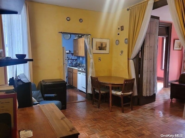 dining room with dark parquet floors