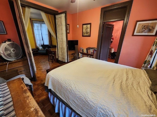 bedroom featuring dark parquet floors and ceiling fan