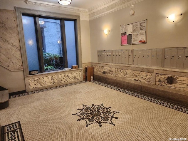 interior space with mail boxes, carpet floors, and ornamental molding