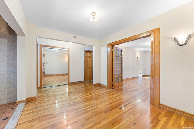 spare room featuring light hardwood / wood-style floors