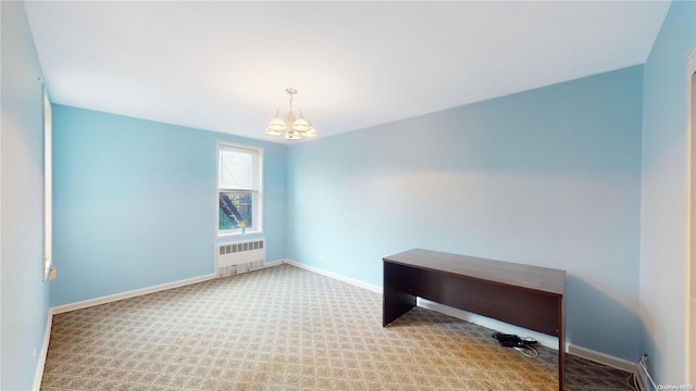 unfurnished room with carpet, a notable chandelier, and radiator heating unit