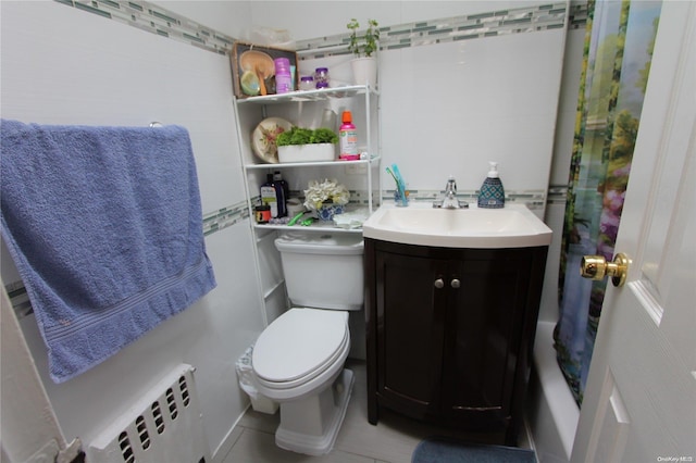 full bathroom with vanity, shower / bath combo with shower curtain, tile patterned flooring, radiator heating unit, and toilet