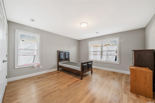 bedroom with light wood-type flooring