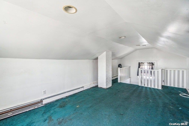 additional living space with carpet floors, a baseboard radiator, and lofted ceiling