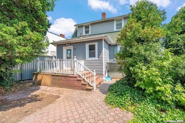 rear view of property with a patio