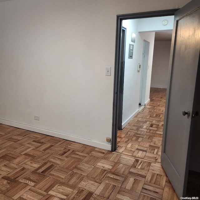 hallway featuring light parquet flooring