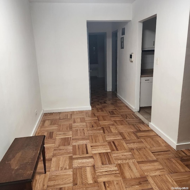 hall featuring parquet floors