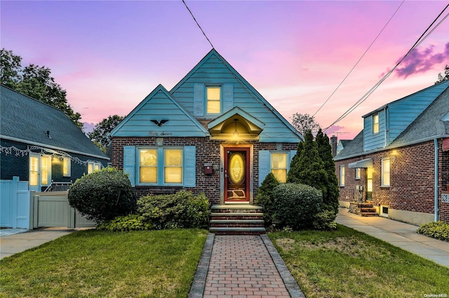 bungalow-style home featuring a lawn