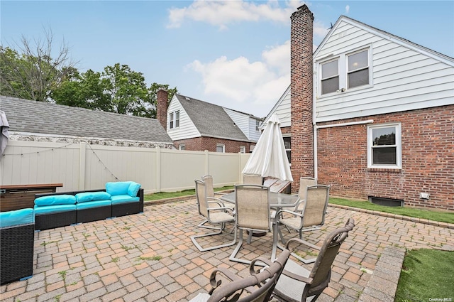 47 Alden Ave, Valley Stream, NY 11580 - fenced backyard with outdoor lounge area, a patio, and outdoor dining space