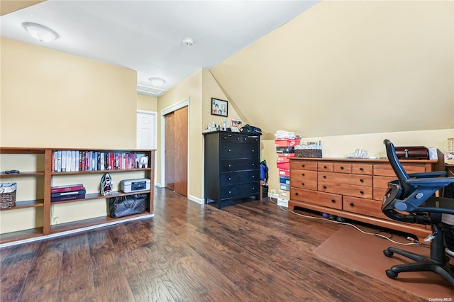 office space with dark wood-type flooring and vaulted ceiling