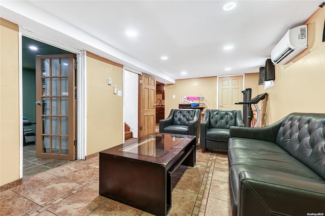 living room featuring an AC wall unit