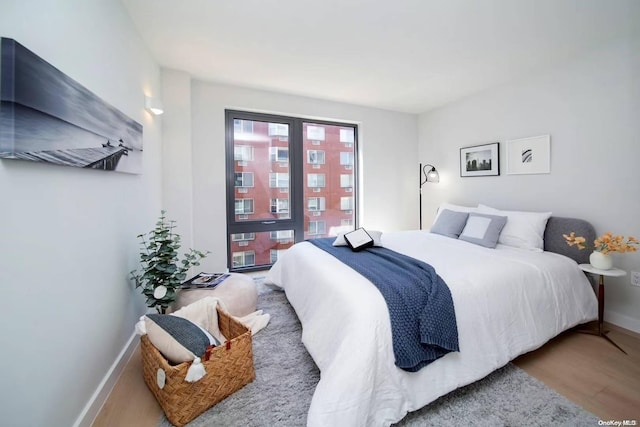 bedroom with hardwood / wood-style flooring