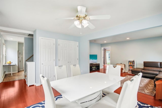 dining room with ceiling fan and hardwood / wood-style floors