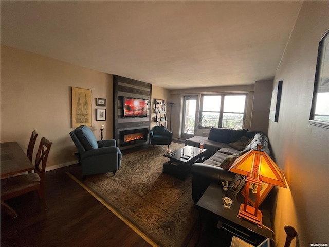 living room with hardwood / wood-style floors and a fireplace