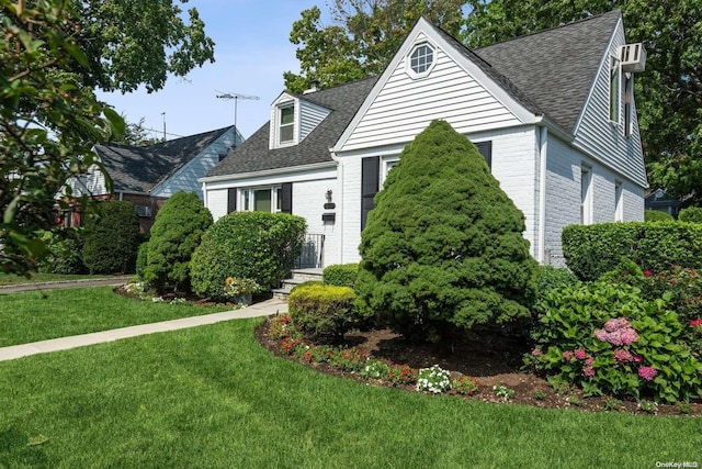 new england style home featuring a front yard