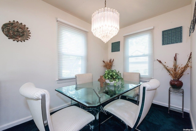 dining space featuring a chandelier