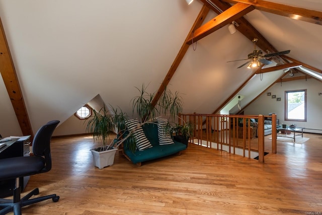 office space with vaulted ceiling with beams, ceiling fan, and light hardwood / wood-style flooring