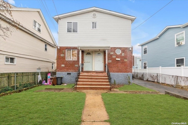 view of front facade with a front yard