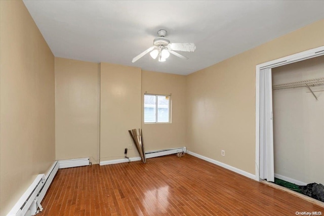 unfurnished bedroom featuring a closet, ceiling fan, hardwood / wood-style floors, and a baseboard radiator