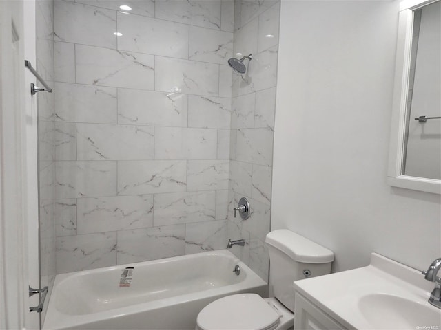 full bathroom with vanity, toilet, and tiled shower / bath