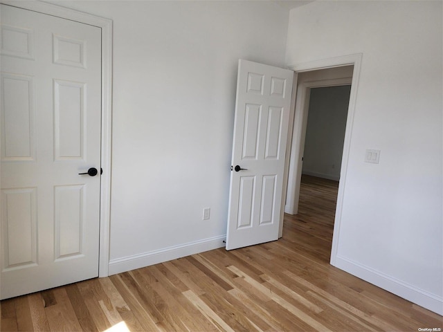 spare room featuring light wood-type flooring