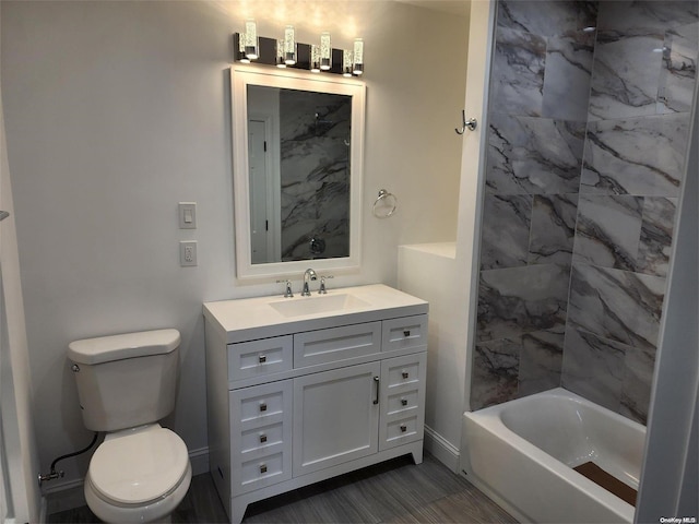 full bathroom featuring washtub / shower combination, vanity, and toilet