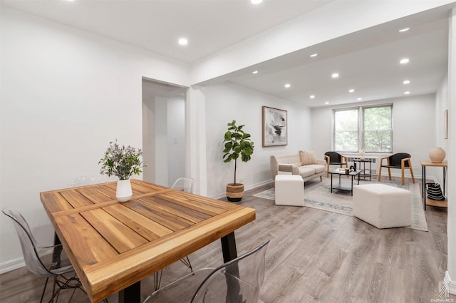 dining area featuring light wood-type flooring