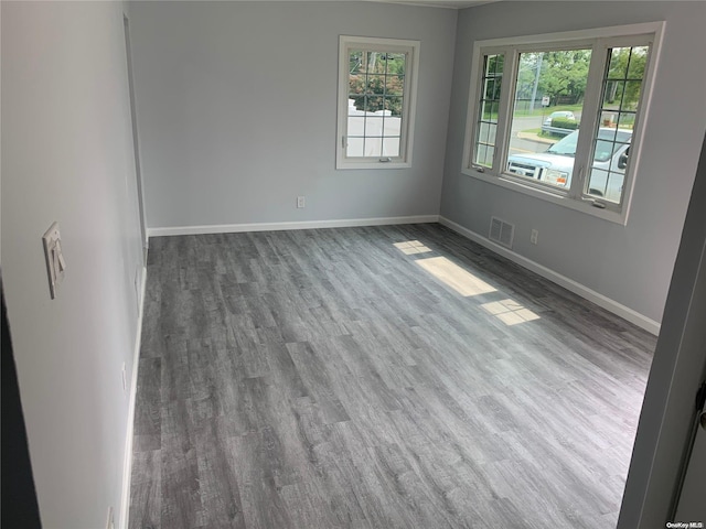 empty room with hardwood / wood-style floors