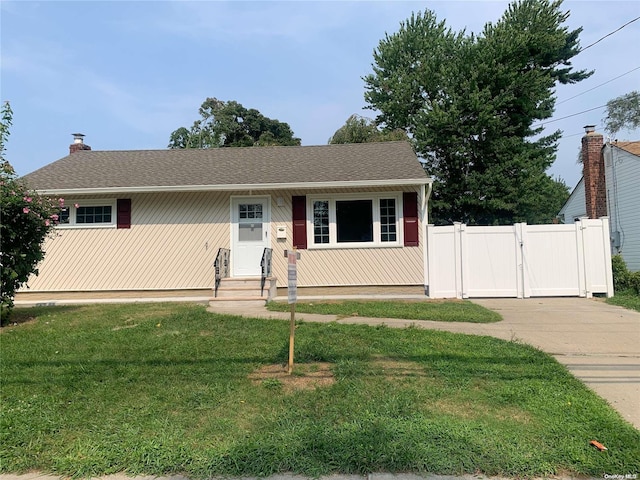 view of front of home with a front lawn