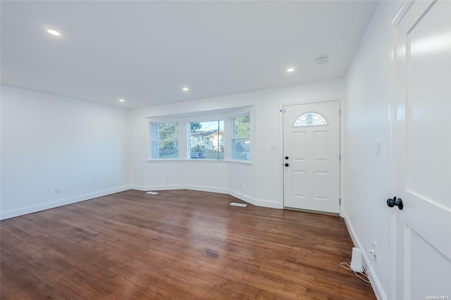 foyer featuring dark wood-type flooring