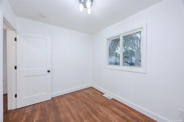 unfurnished room featuring hardwood / wood-style floors