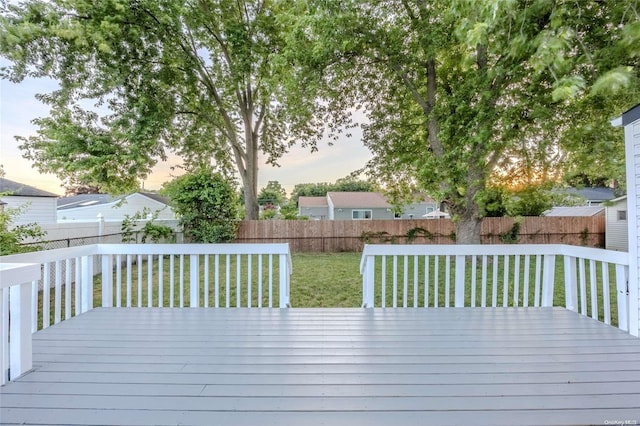 deck at dusk with a lawn