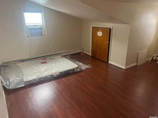 additional living space with dark hardwood / wood-style flooring, lofted ceiling, and baseboard heating