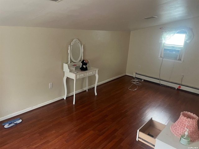 bonus room with cooling unit, dark wood-type flooring, and a baseboard radiator