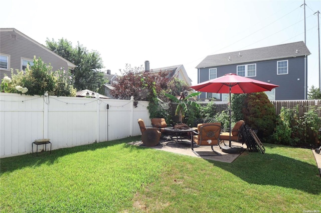 view of yard featuring a patio and an outdoor fire pit