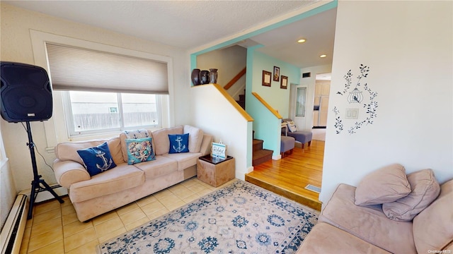 living room featuring a baseboard radiator and light wood-type flooring