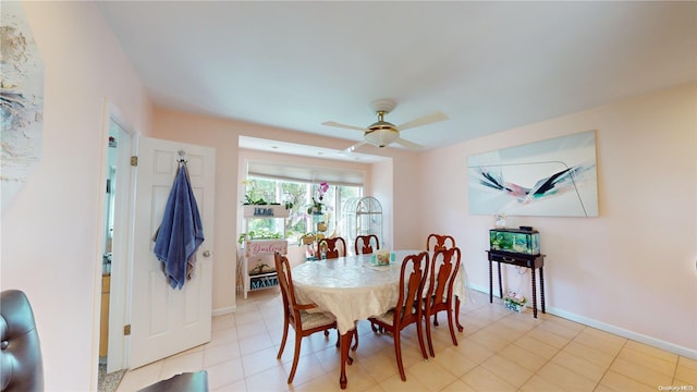 dining area with ceiling fan and light tile patterned floors