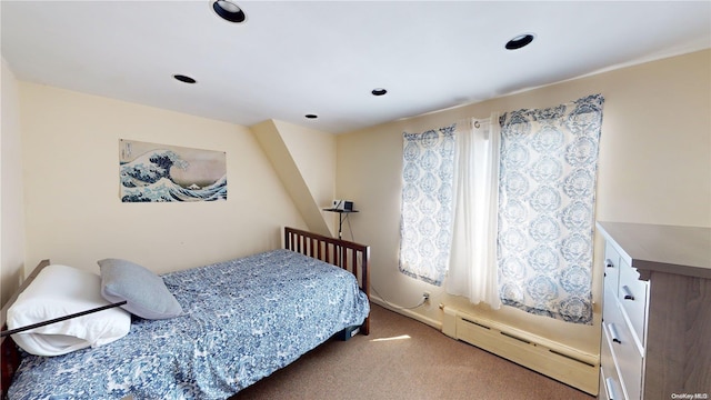 carpeted bedroom featuring a baseboard radiator