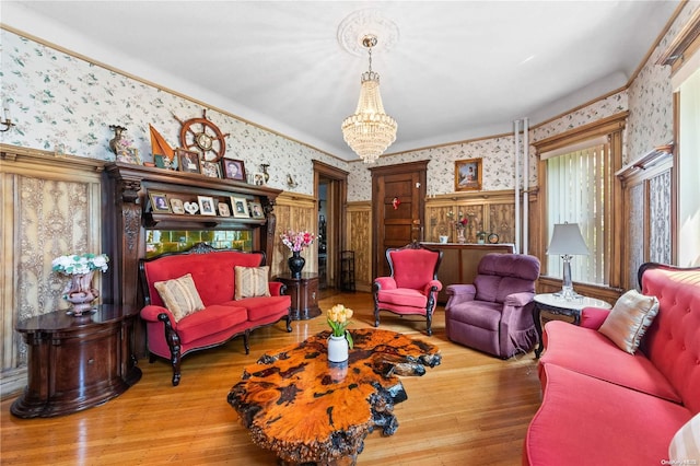 living room featuring wood-type flooring and a notable chandelier