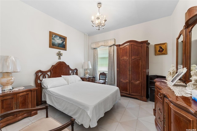 bedroom featuring an inviting chandelier