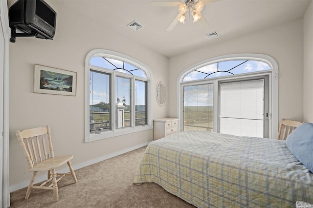 bedroom with light carpet, ceiling fan, and lofted ceiling