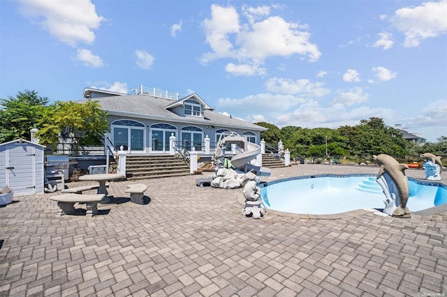 48 S Old Neck Rd, Center Moriches, NY 11934 - view of pool with stairway, a water slide, a patio, and an empty pool