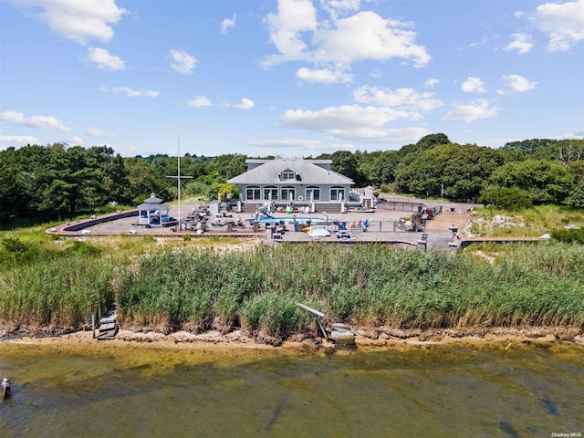 back of property with a water view