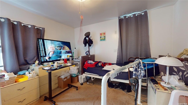 bedroom featuring light colored carpet