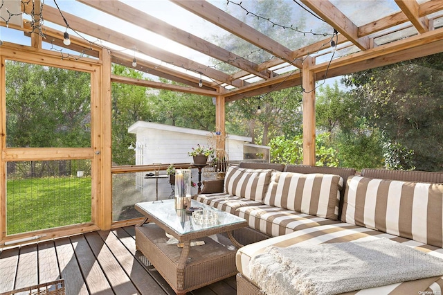 wooden deck with an outdoor living space and a pergola