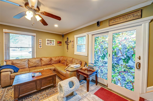 tiled living room with crown molding, ceiling fan, and a healthy amount of sunlight