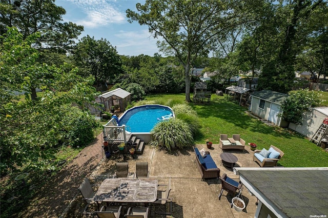 view of pool featuring an outbuilding and an outdoor hangout area