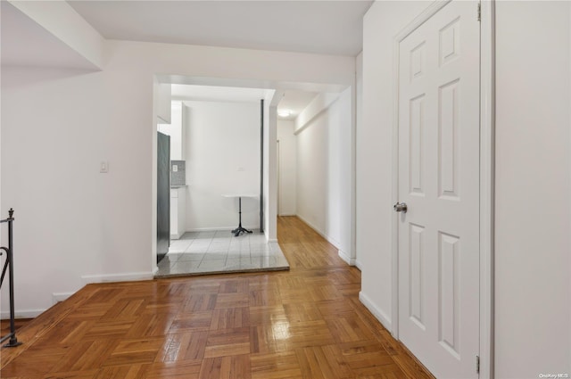 hall featuring parquet floors