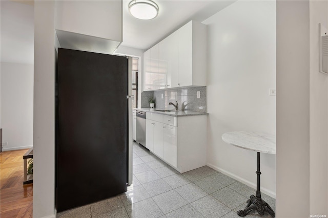 kitchen featuring backsplash, white cabinetry, dishwasher, and sink